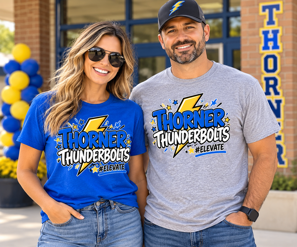 Woman and man wearing blue and gray Thorner Thunderbolts #ELEVATE adult school spirit shirts outside a school.