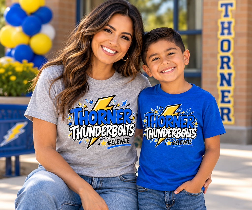 Adult and child wearing matching gray and blue Thorner Thunderbolts #ELEVATE school spirit shirts outside a school.