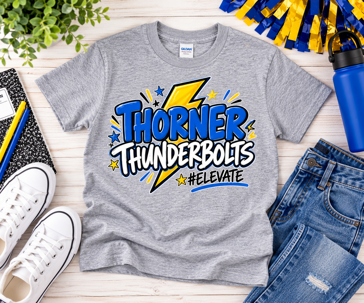 Gray Gildan youth Thorner Thunderbolts #ELEVATE school spirit shirt with blue and gold lightning bolt design styled in a school-themed flat lay.
