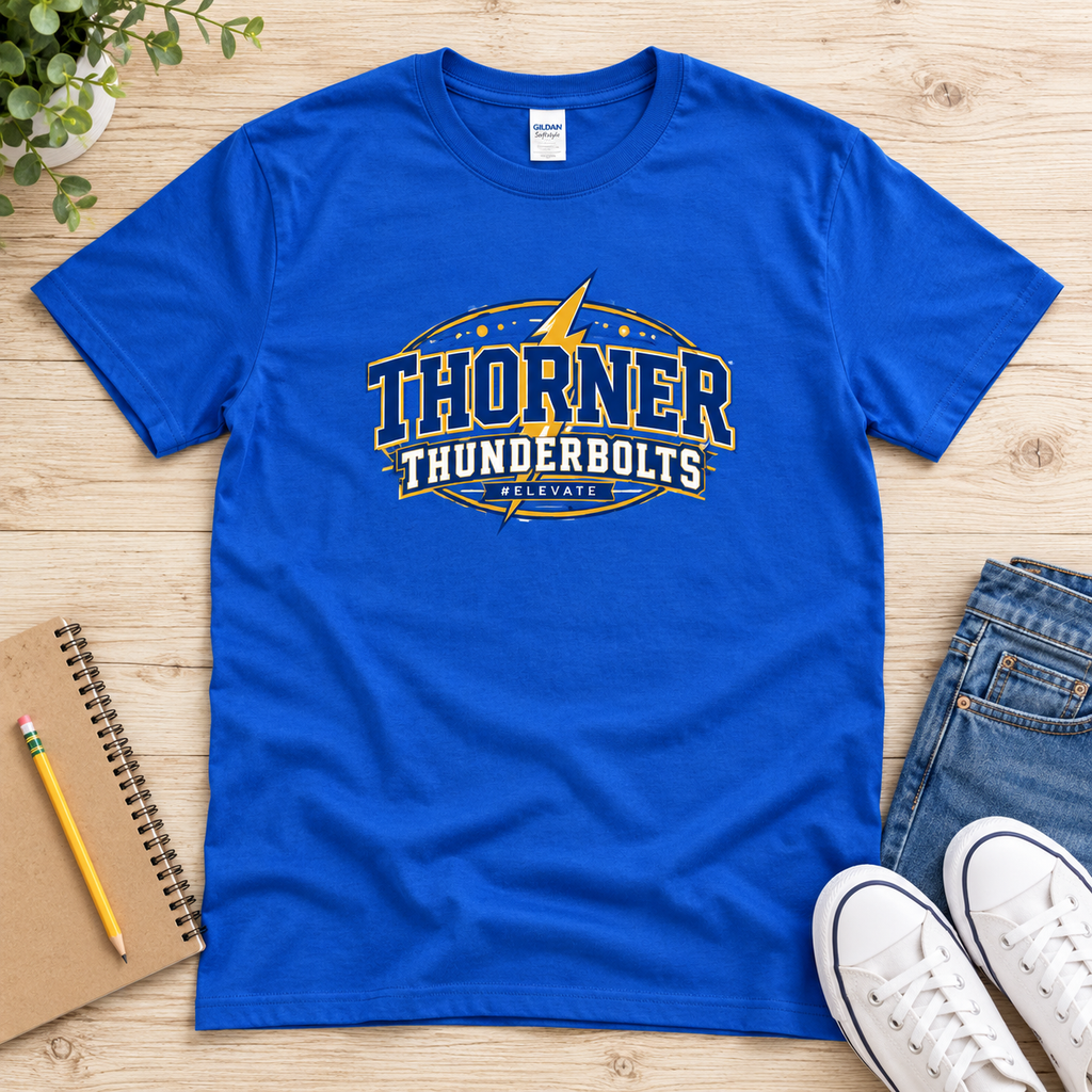 Royal blue Thorner Thunderbolts T-shirt laid flat on pale wood, featuring a gold lightning bolt, varsity lettering, and #ELEVATE on the front.